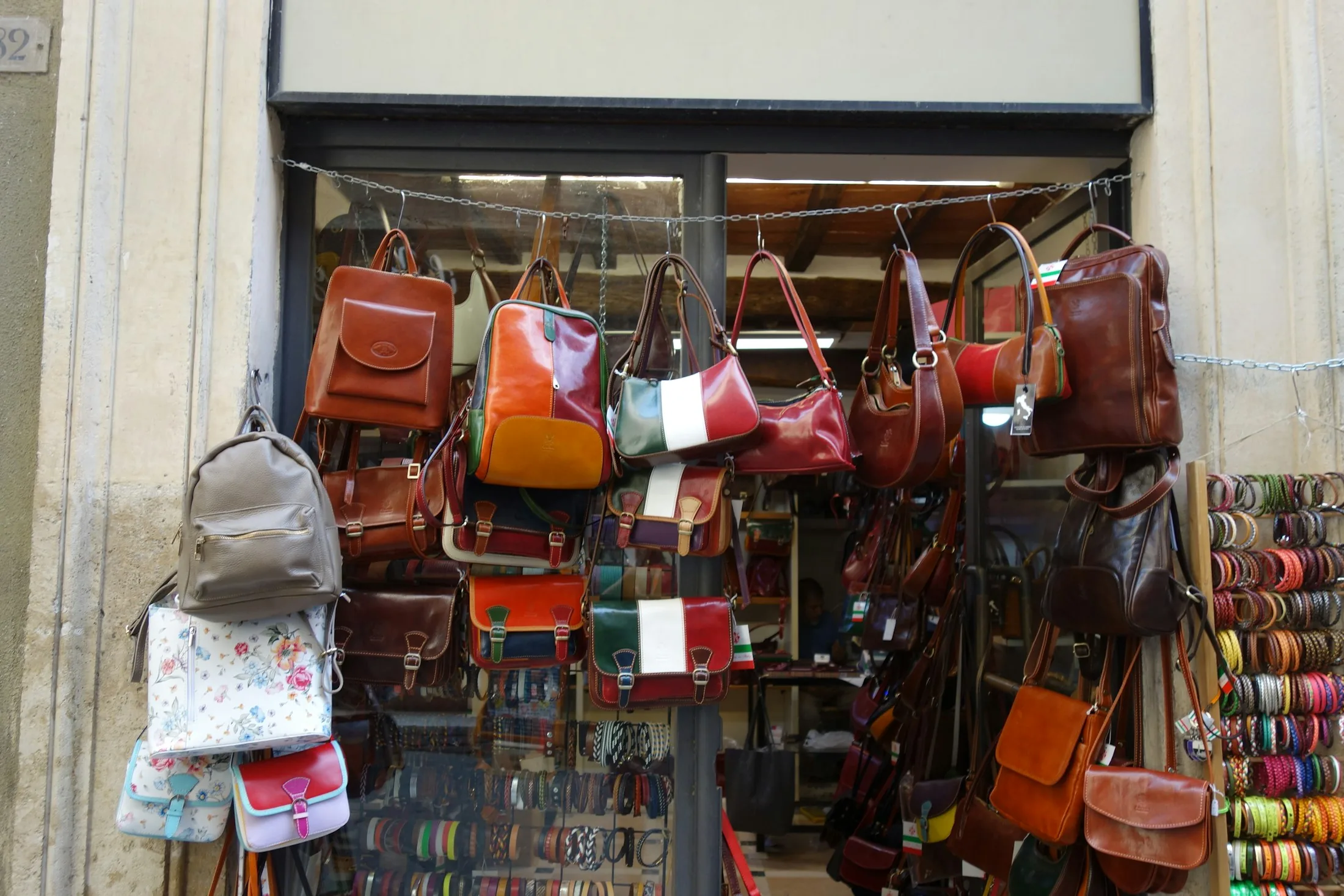 Leather handbags displayed outside a shop